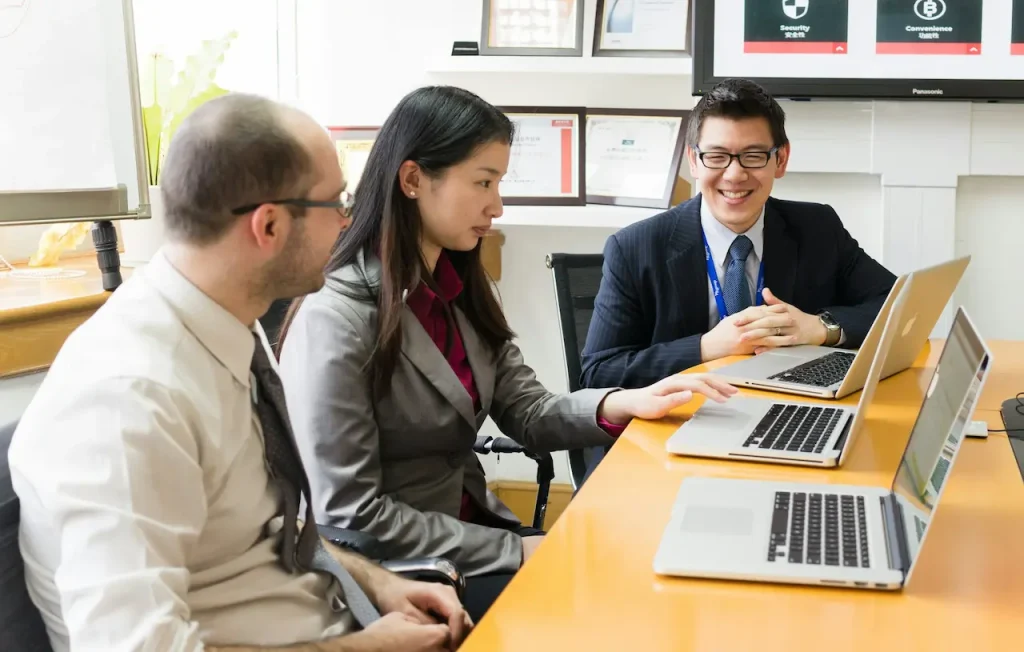 Man and Woman Sitting in a Business Meeting 
