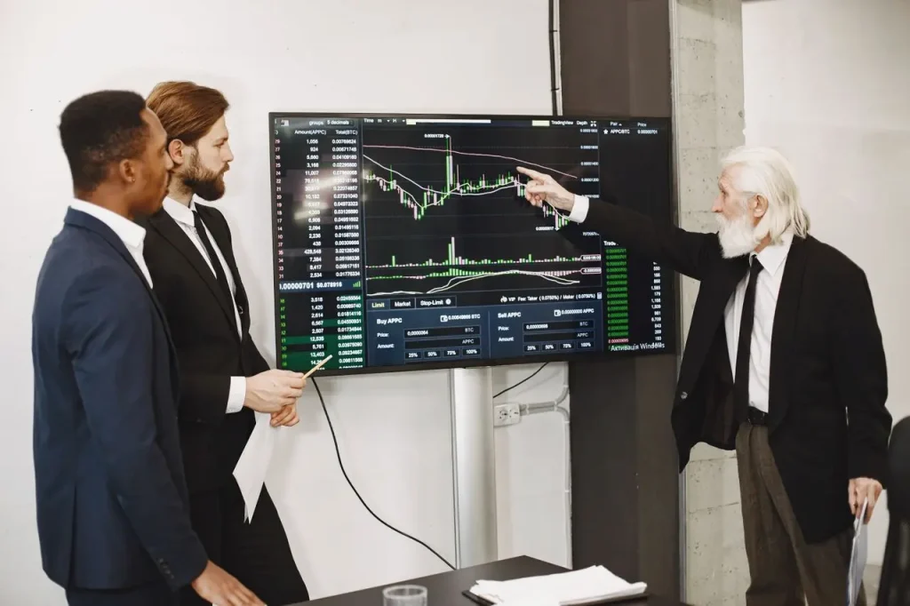 Business Team Reviewing Stock Market Data on a Screen 